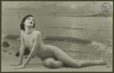 Nude woman on beach.
